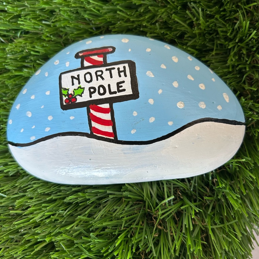 Festive Painted Stone with North Pole Design
